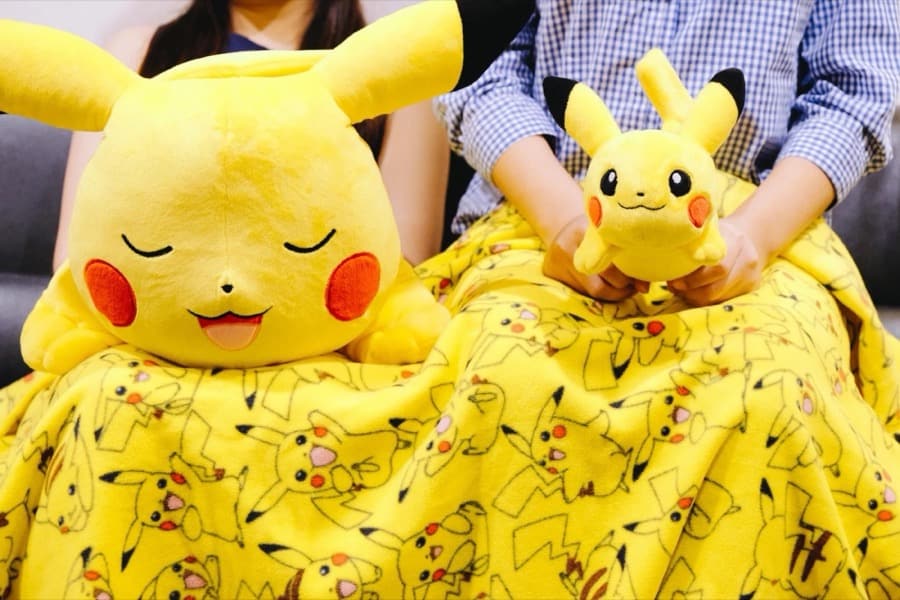 Pikachu plush toys and a Pikachu blanket