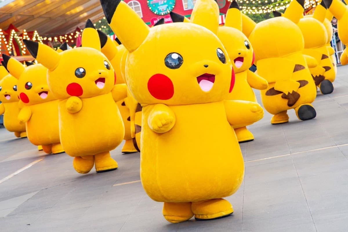 Live Pikachu mascots parading at a Bangkok event